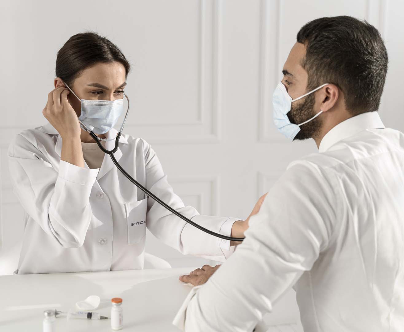 Doctor with male patient